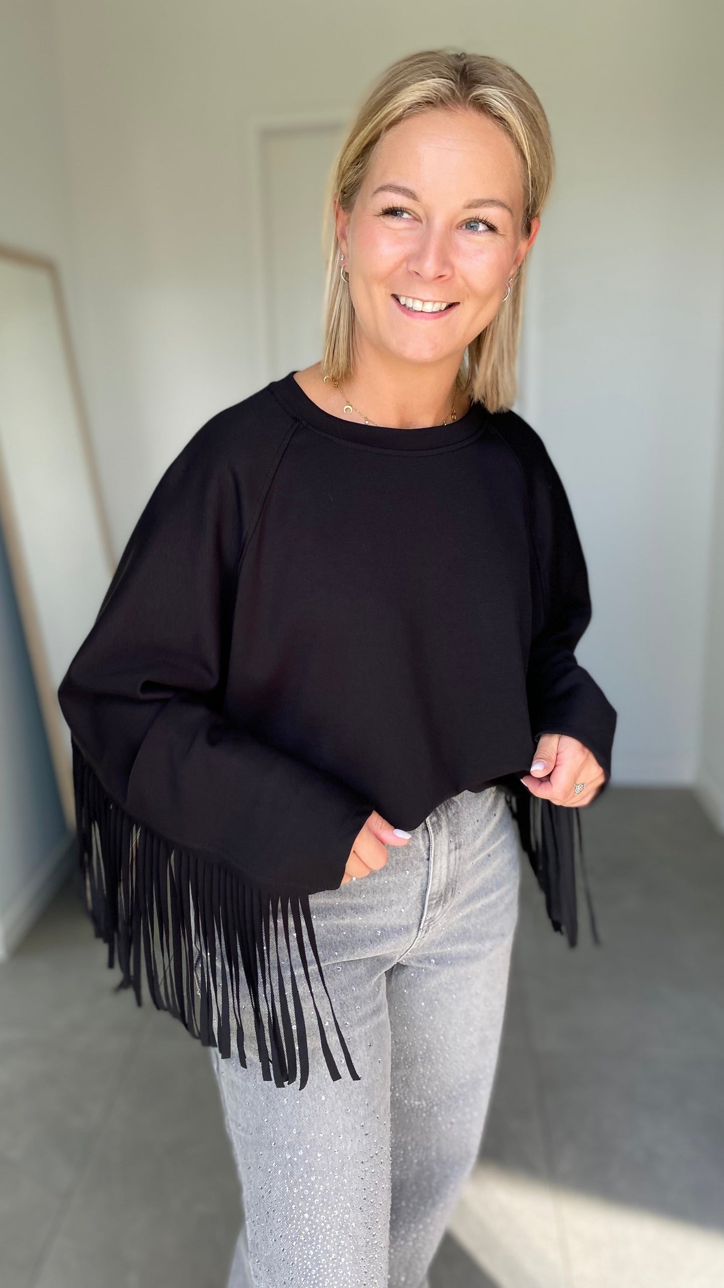 Black fringe sweater
